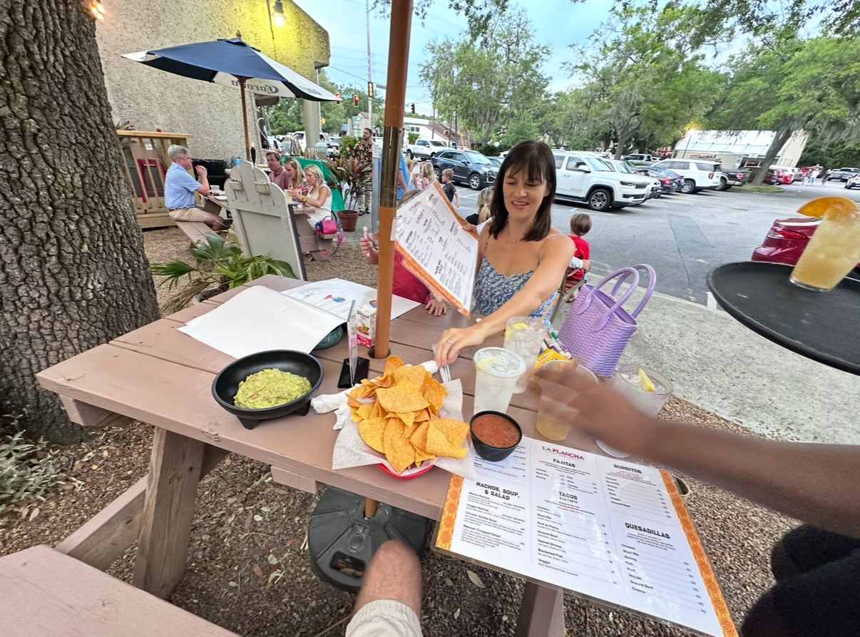 Family eating lunch outside.